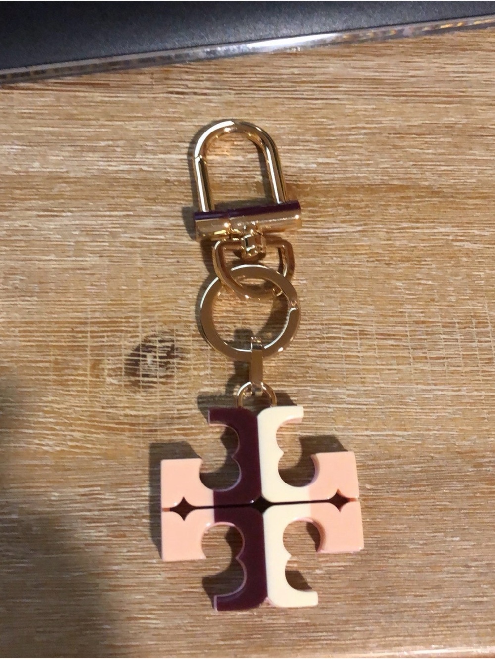 Tory Burch Gold Tone Key Fob with Pink and Cream Logo Charm